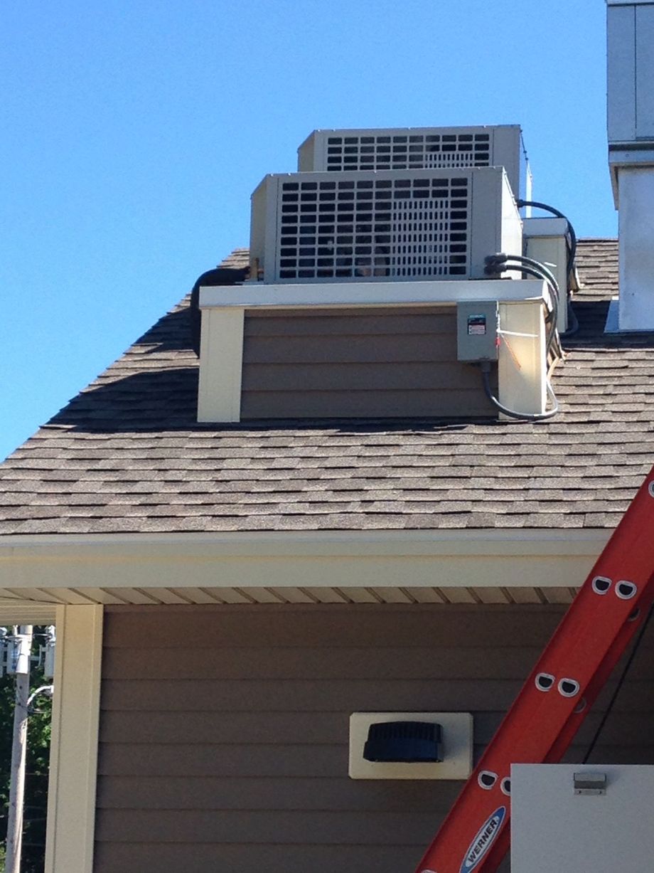 A ladder is sitting on the side of a house