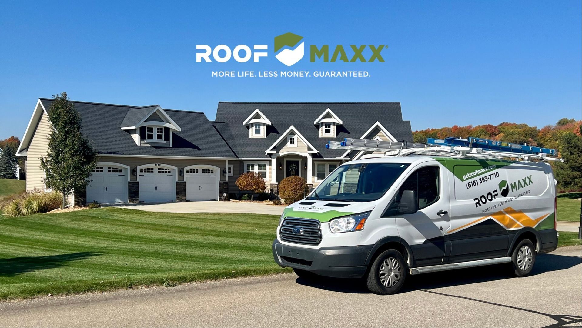 Roof Maxx service van parked in front of a suburban house with a shingled roof