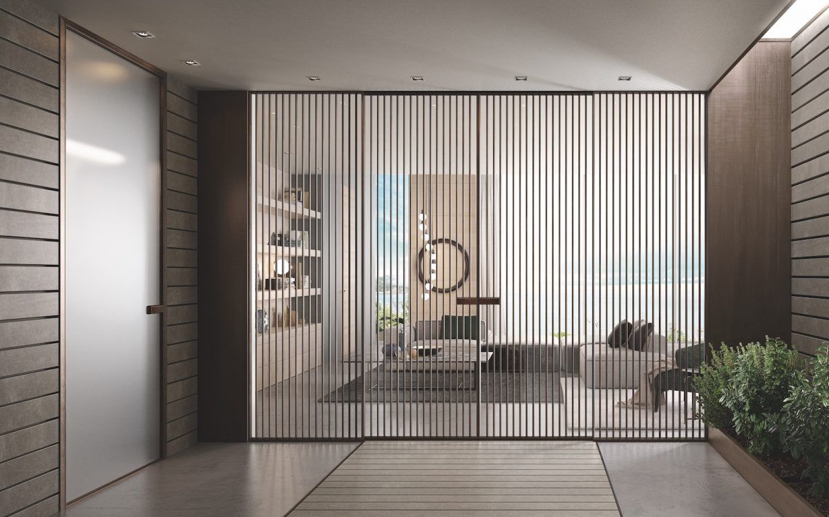 Hall di ufficio moderna e minimalista con parete divisoria in vetro, scrivania, sedia e piante in vaso.