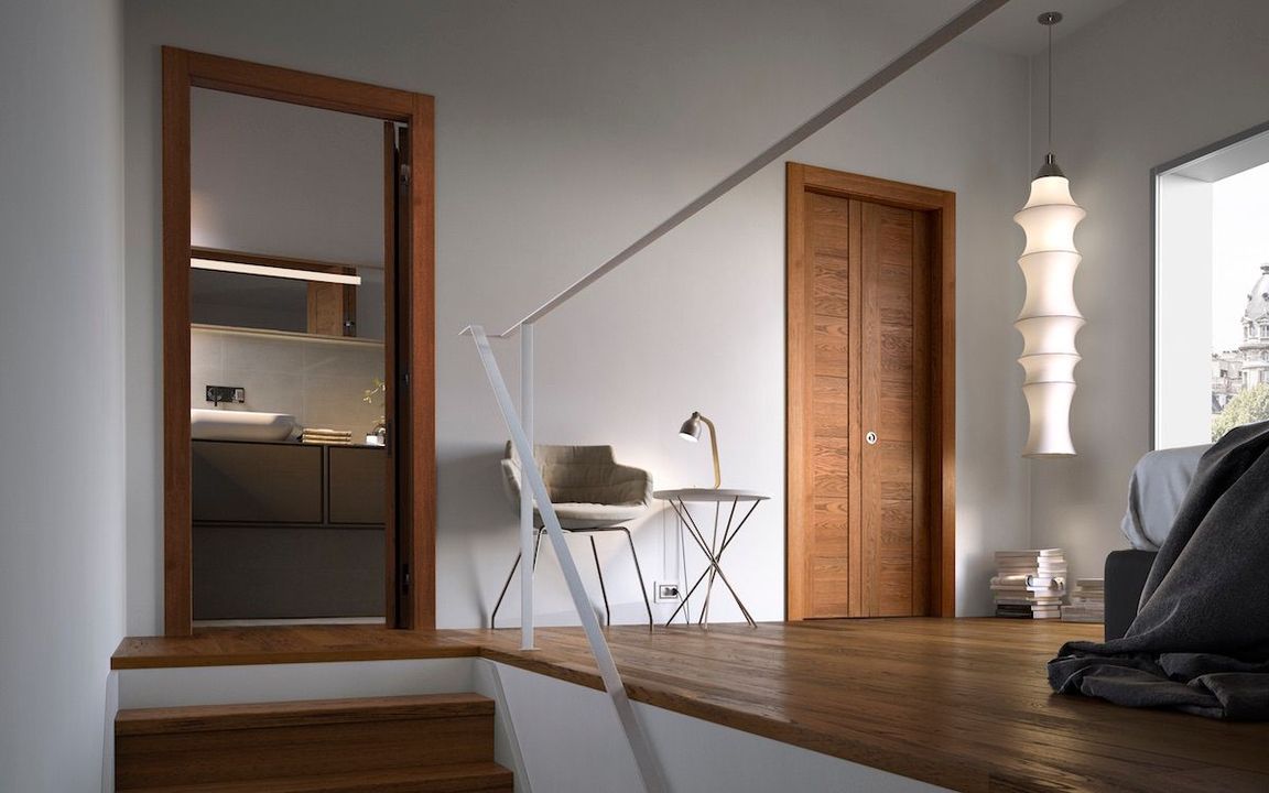 Camera da letto moderna con pavimento in legno, porta a specchio, scrivania, sedia e lampada a sospensione bianca vicino a una finestra.