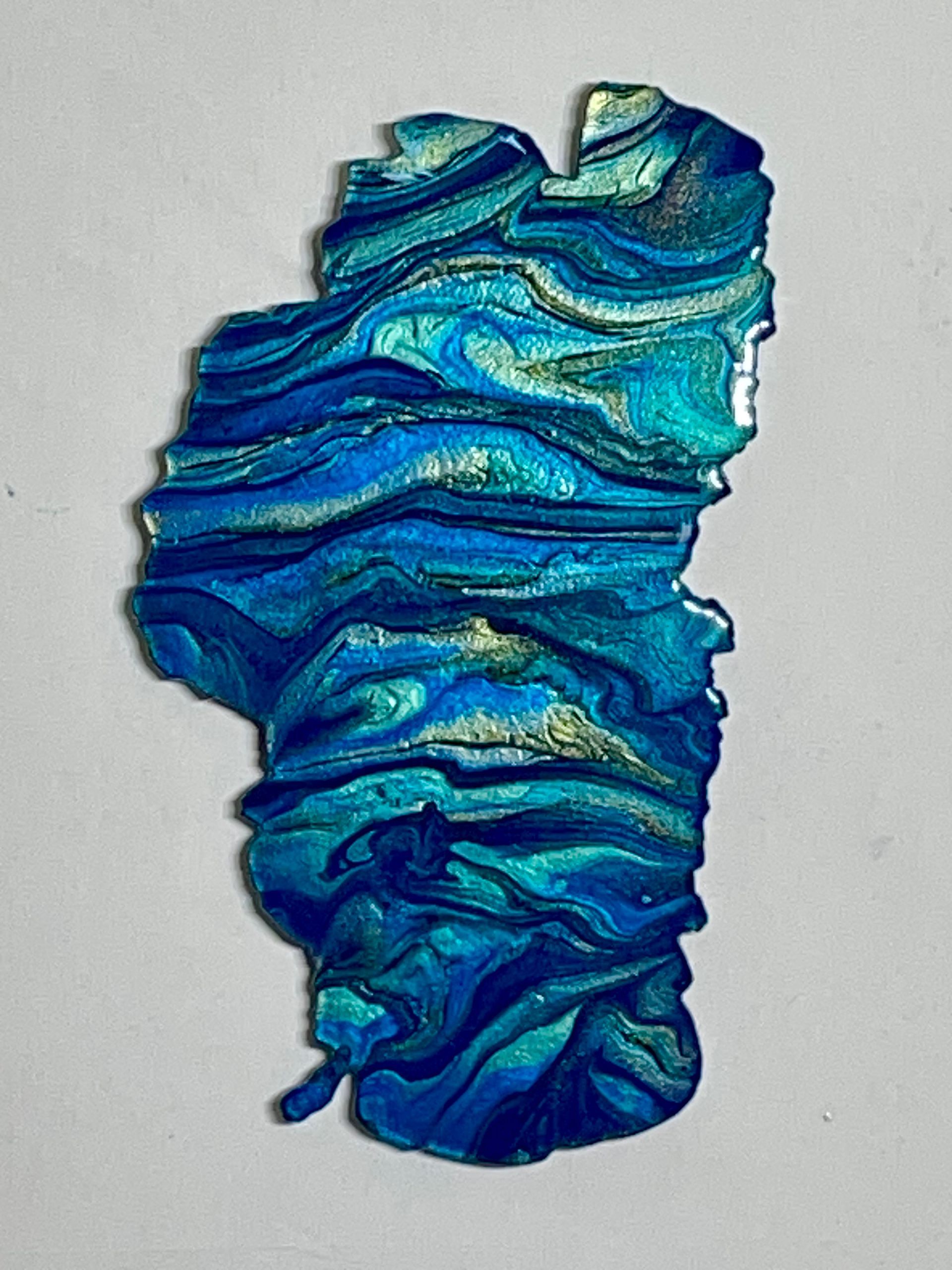 Abstract blue and teal paint swirls on a light background