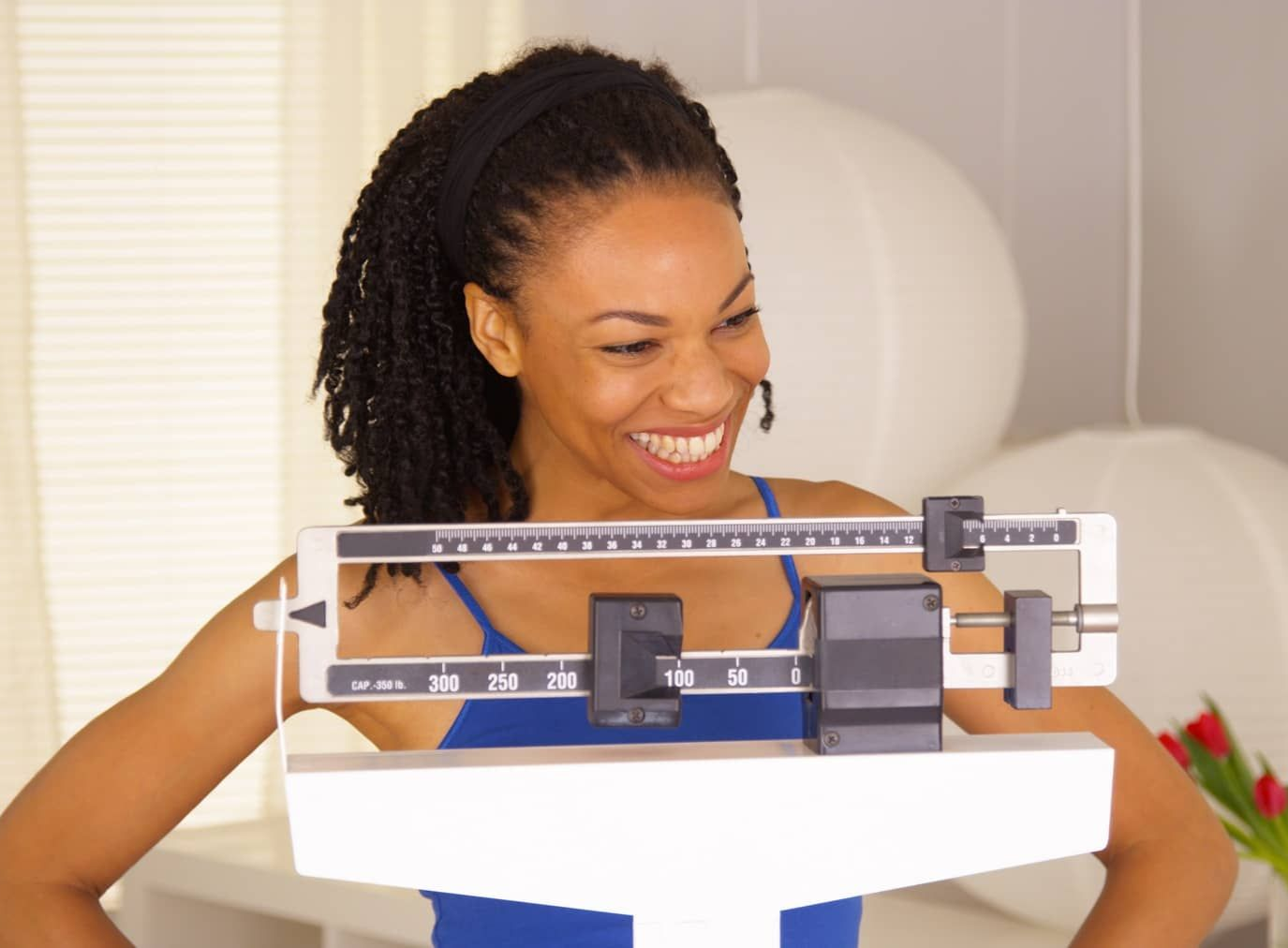 Happy young woman lost her weight