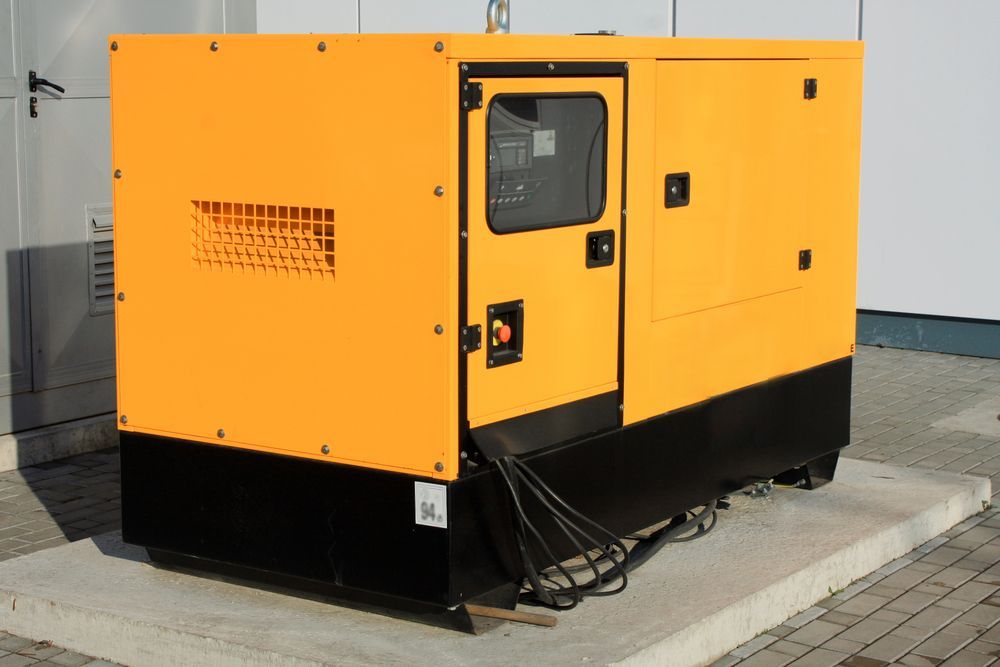 Yellow Industrial Generator on a Concrete Pad Outdoors — CQ Pro-Lec in Pacific Heights, QLD