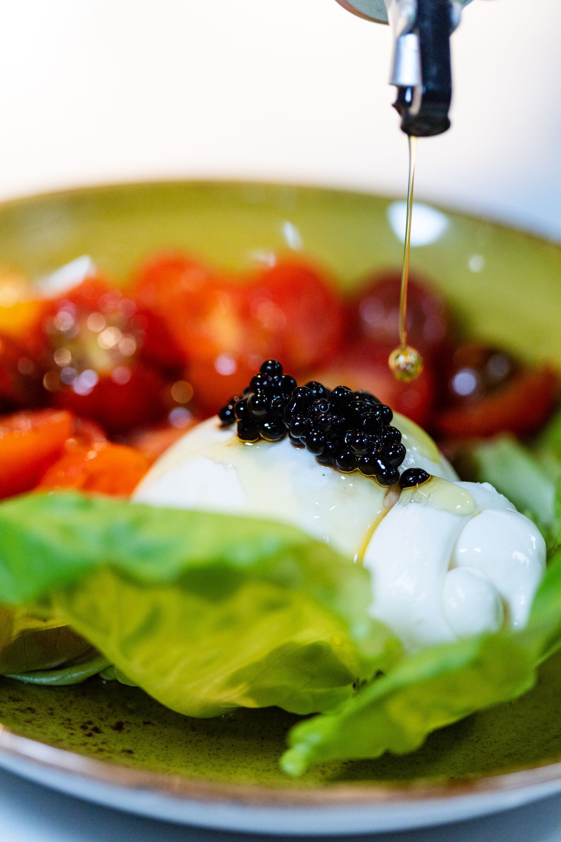 a close up of a plate of food with caviar on top