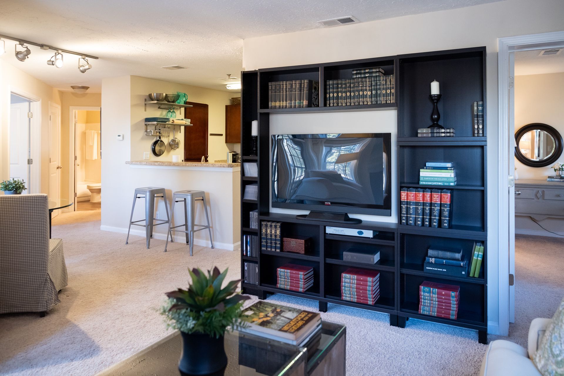 A living room filled with furniture and a flat screen tv