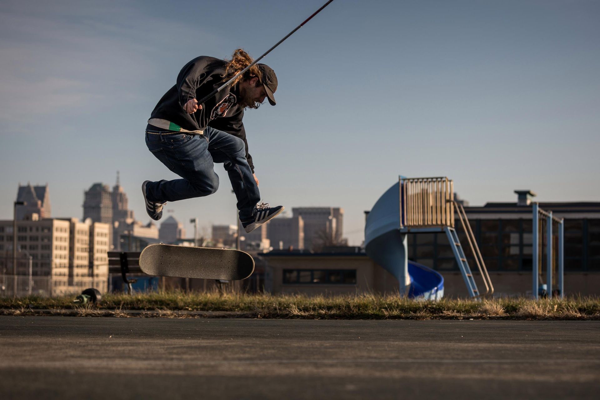 Dan pops a huge 360 flip and the board is spinning in midair with Dan floating above it.