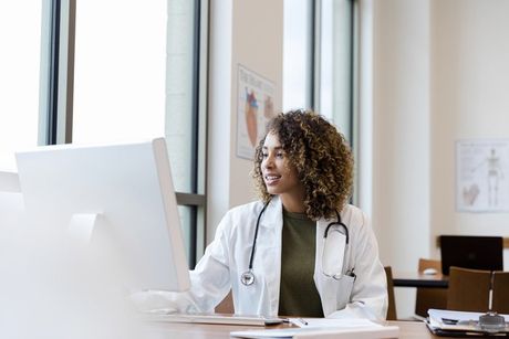 Doctor Reviewing a Patient Record — Cooper City, FL — MeDx Billing LLC Doctor Reviewing a Patient Record — Cooper City, FL — MeDx Billing LLC