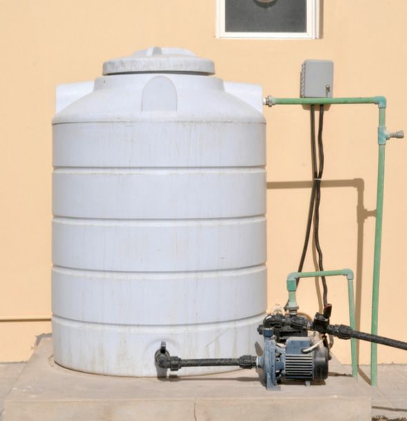 A White Water Tank With A Pump Attached To It — Flavell Plumbing (NT) Pty Ltd In Ciccone, NT