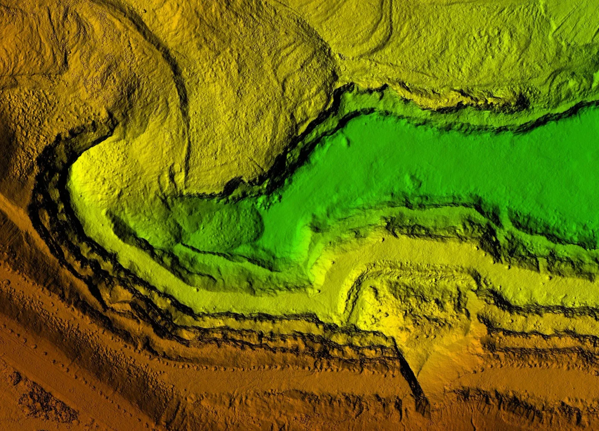 Colored topographic map showing a winding canyon with layered rock formations, green at the lowest elevation.