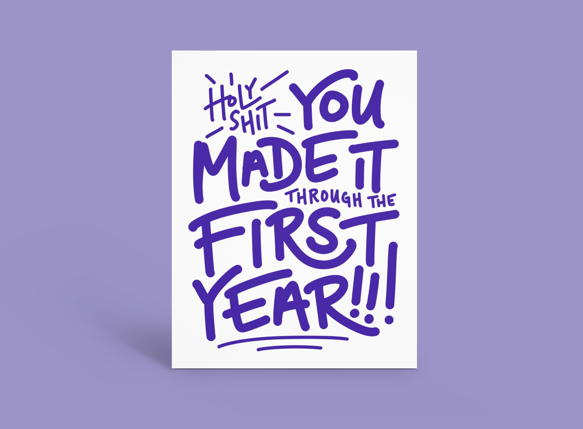 Purple handwritten note reading “holy shit you made it through the first year!!!” on white paper.