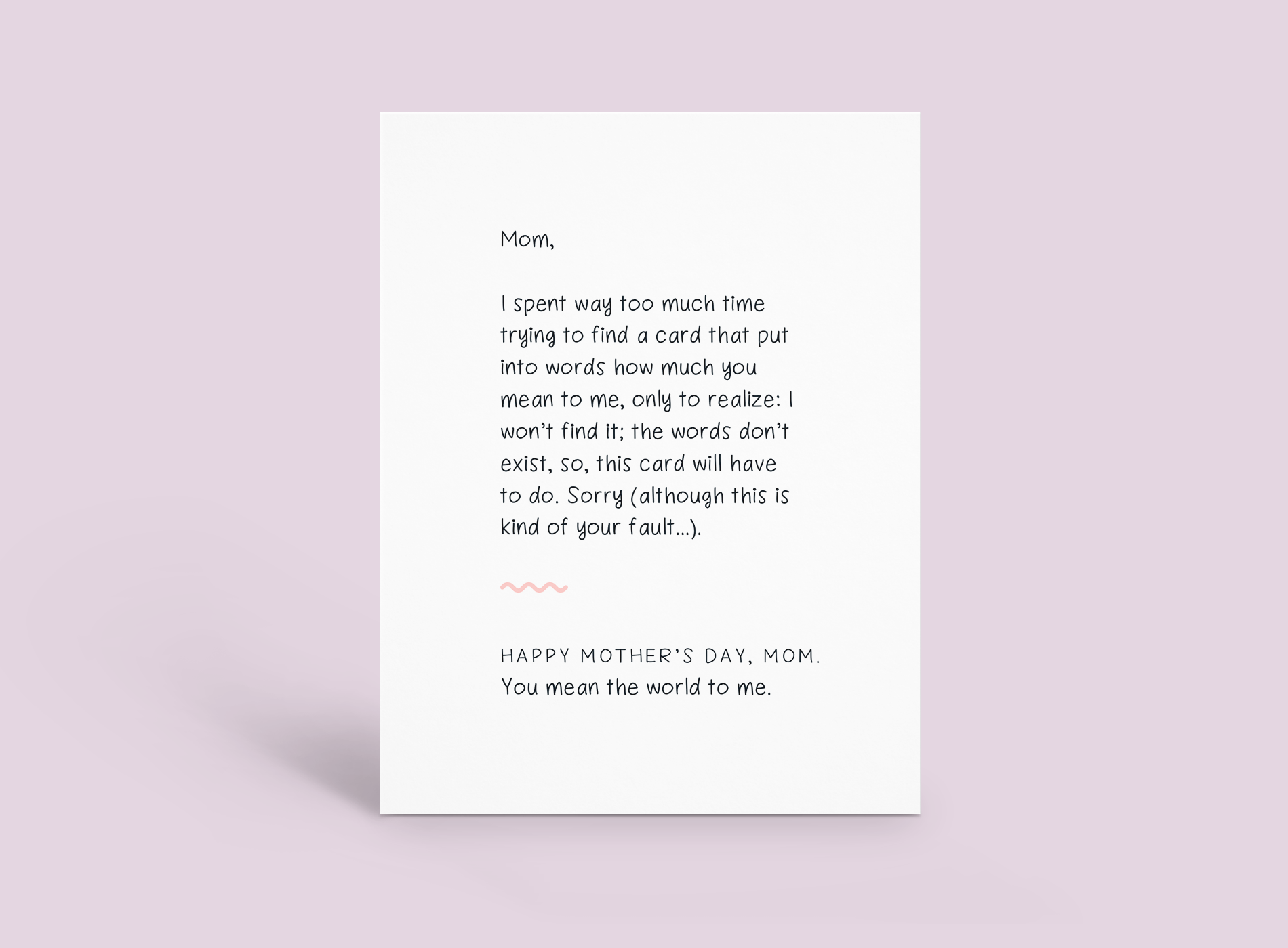 White note card with handwritten text on a pale pink background