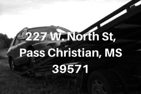 Black and white view of a truck and trailer with address text: 227 W. North St, Pass Christian, MS 39571