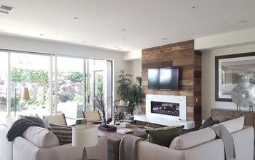 A living room filled with furniture and a fireplace.