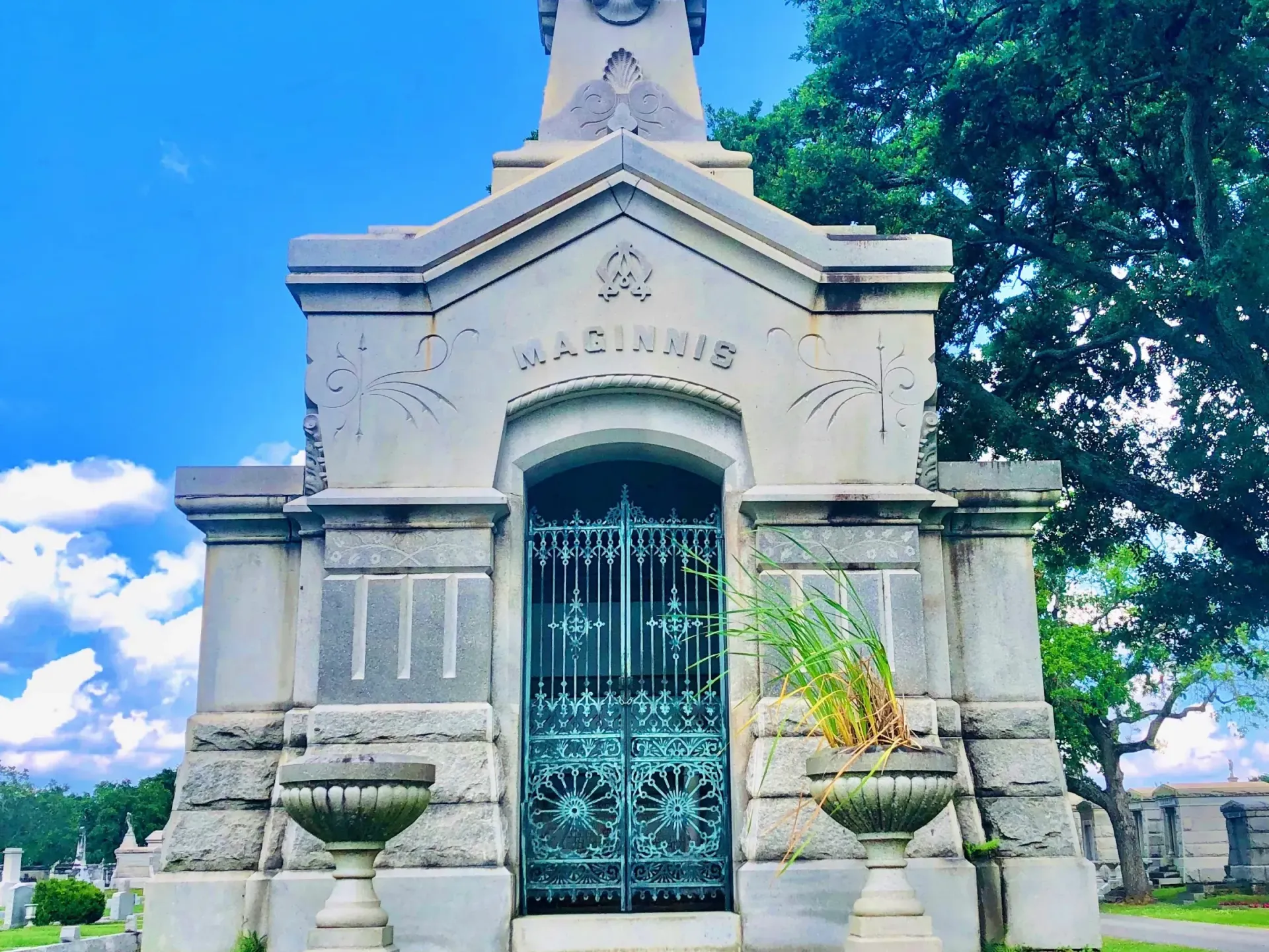 A cemetery with a mausoleum with the name marie on it