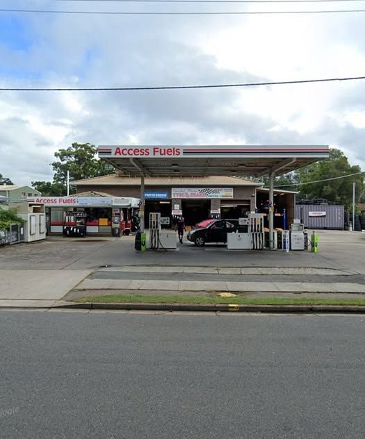 An Access Fuels Gas Station With A Car Parked In Front Of It — Camden Haven Tyre & Brake Centre In Laurieton, NSW