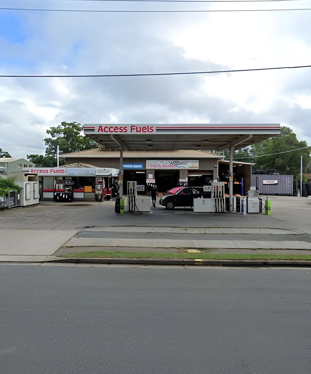 An Access Fuels Gas Station With A Car Parked In Front Of It — Camden Haven Tyre & Service Centre In Laurieton, NSW
