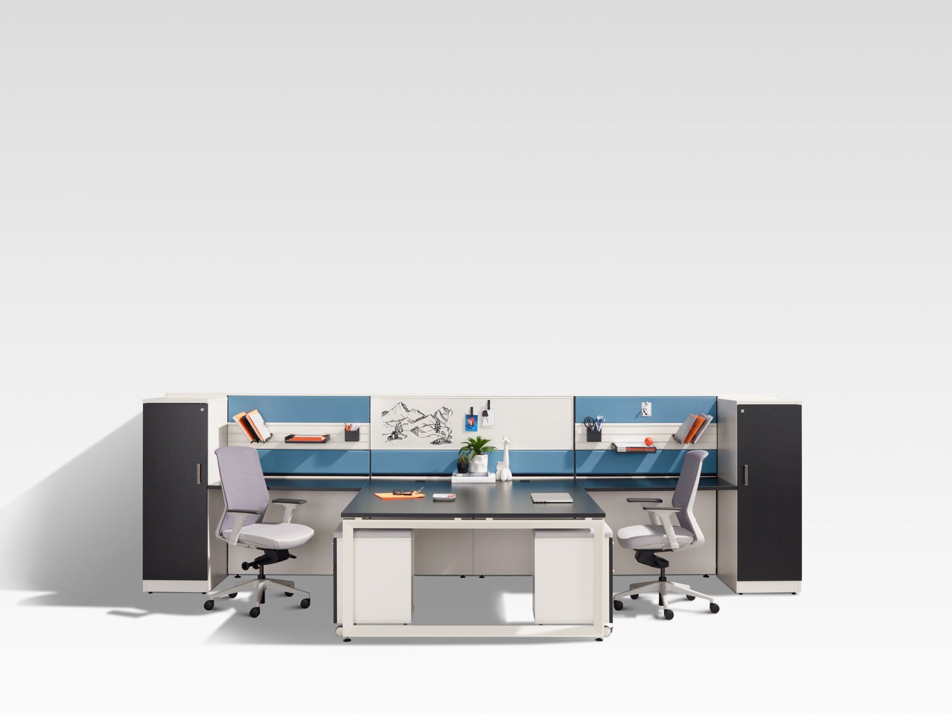 a cubicle with two desks and two chairs with a drawing on the wall