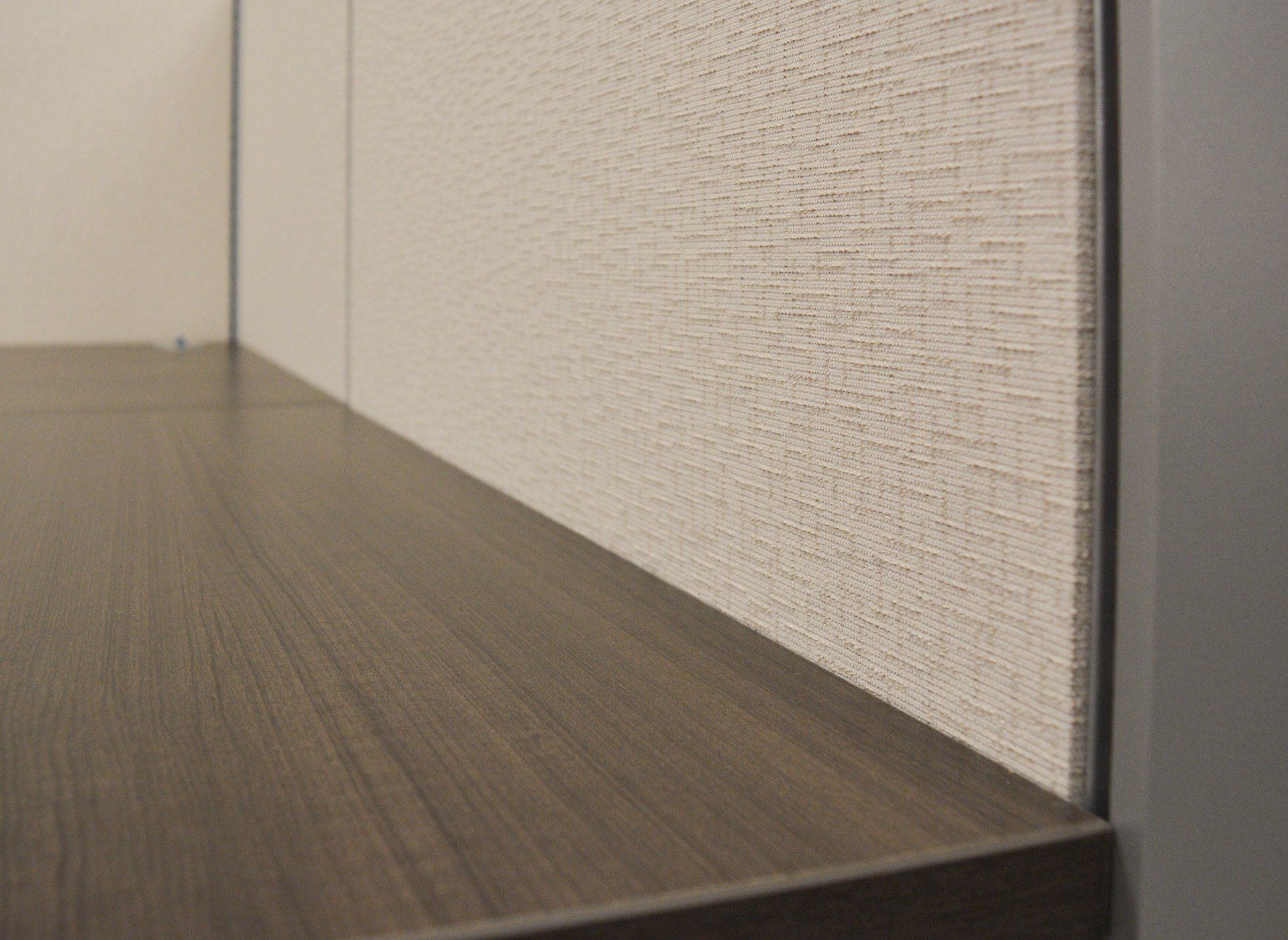 close up of a cubicle panel and desk top