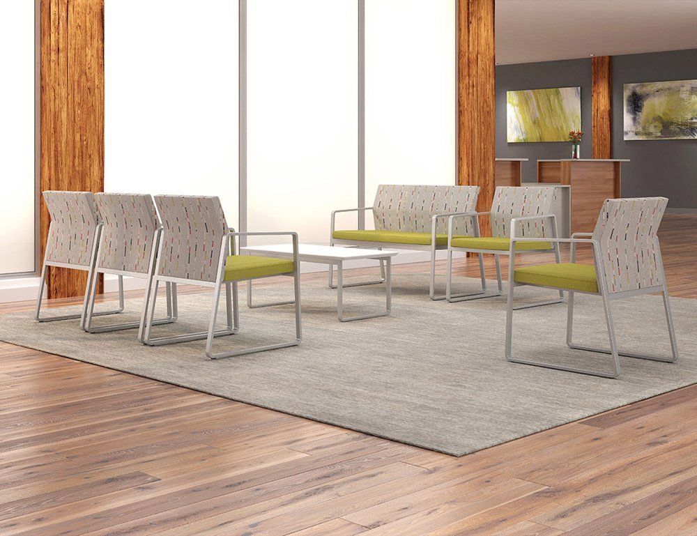a waiting room with chairs and a table in it