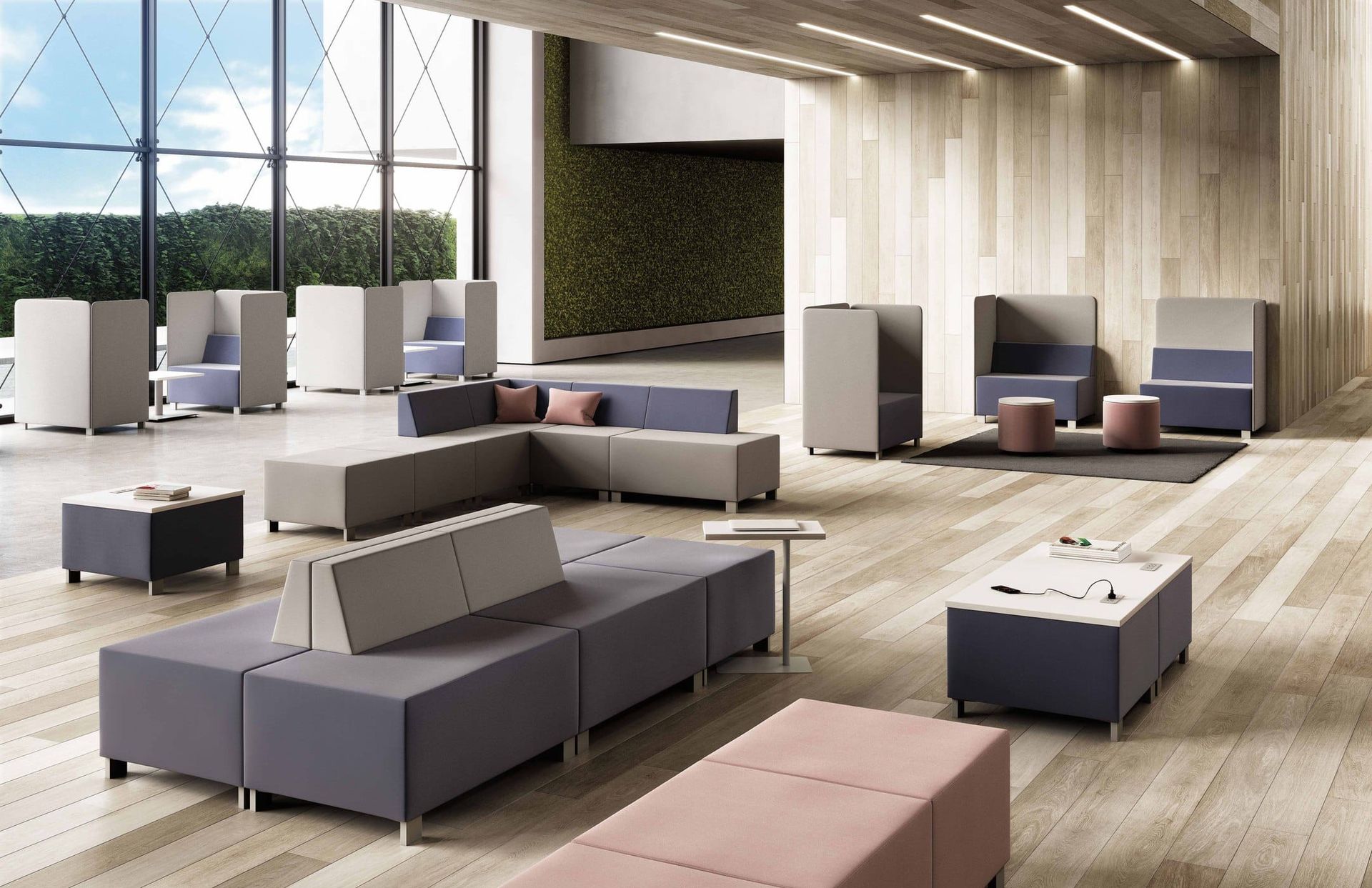 Modern office lounge with modular seating in neutral colors, large windows, and a natural wall.