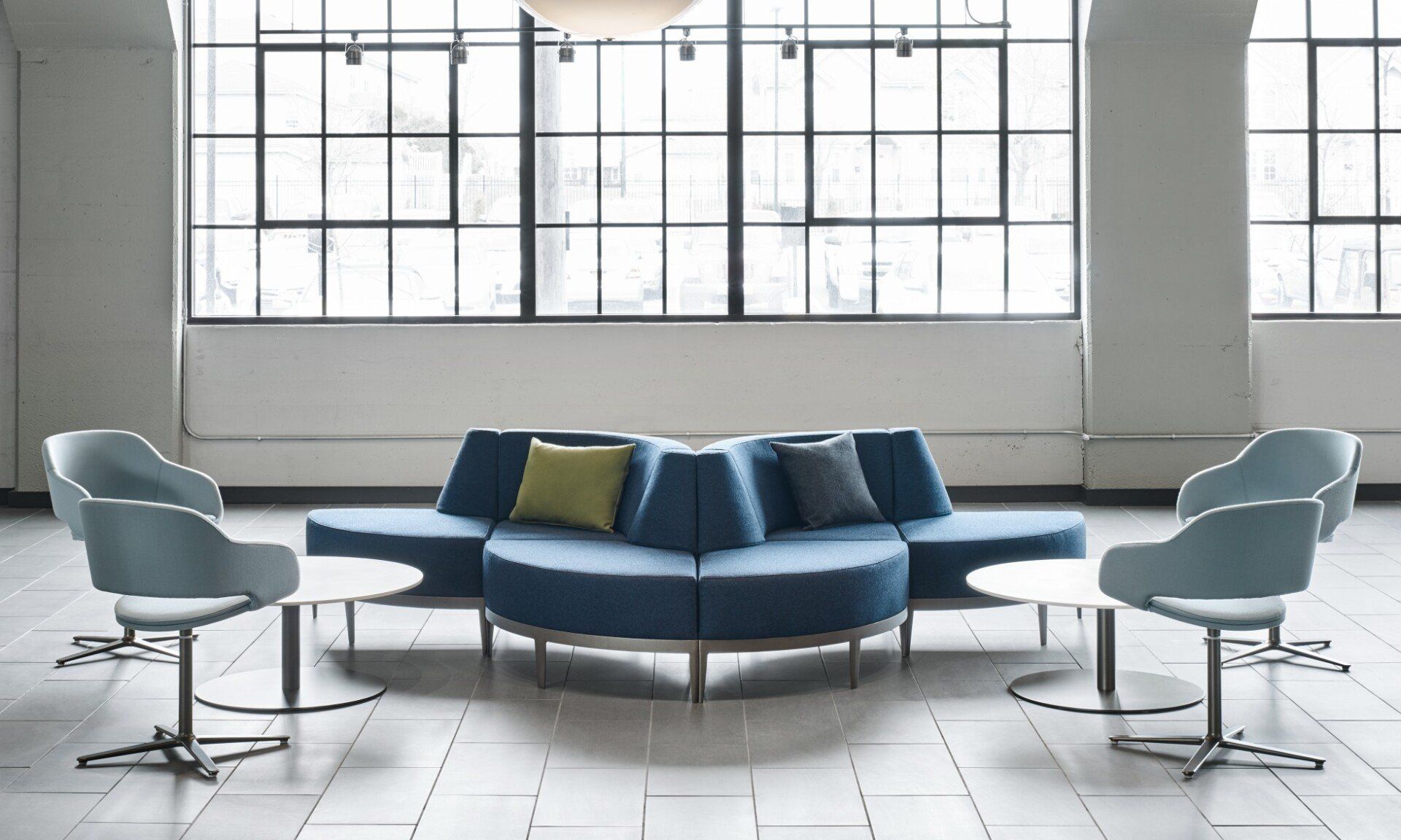 Modular low back sofa & swivel chairs seating group