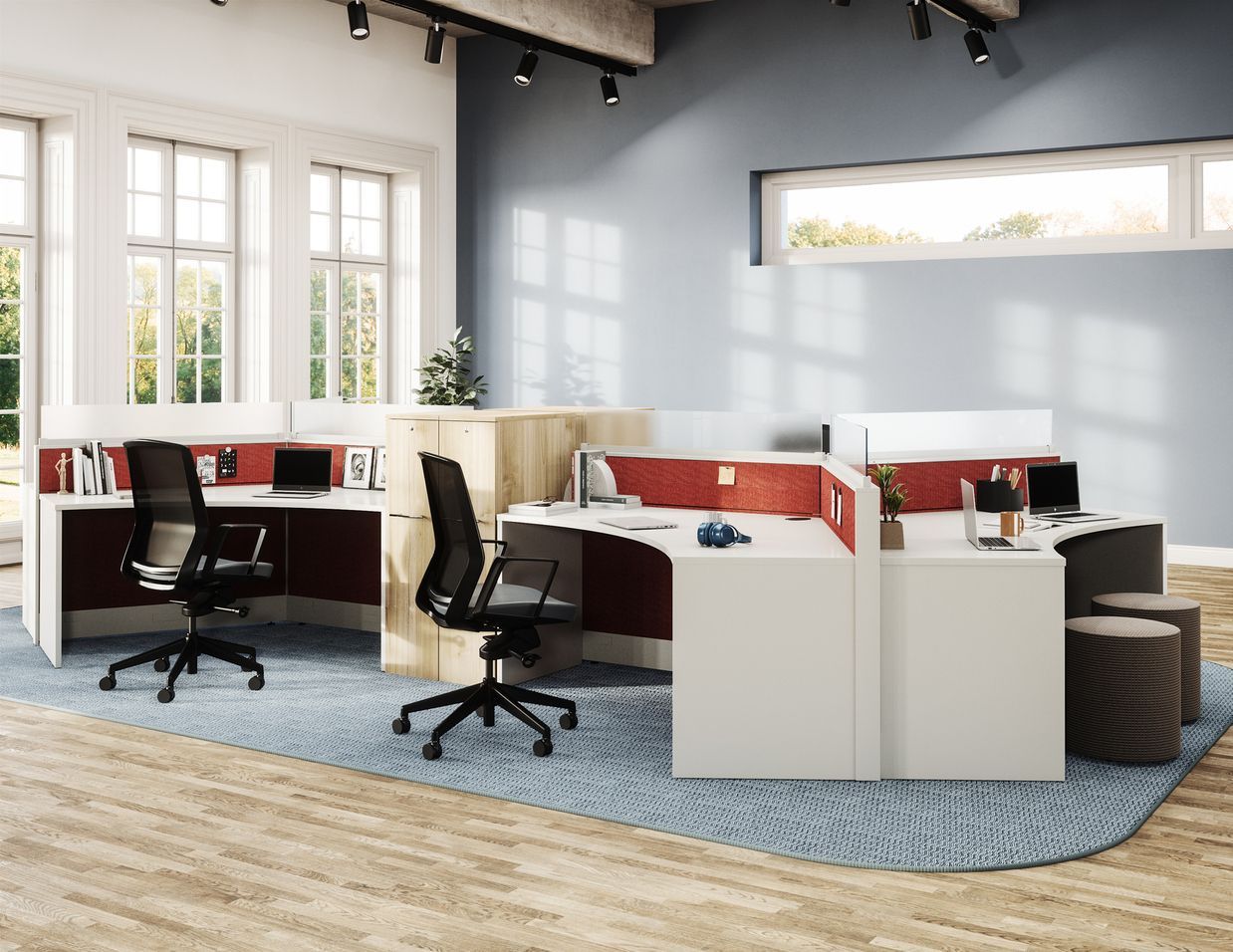 White office workstation with orange dividers, black chairs, and a blue rug.