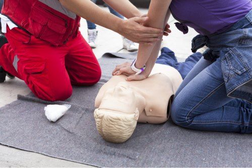 A Group of People Are Practicing First Aid on a Mannequin — Revive Training in Lismore, NSW