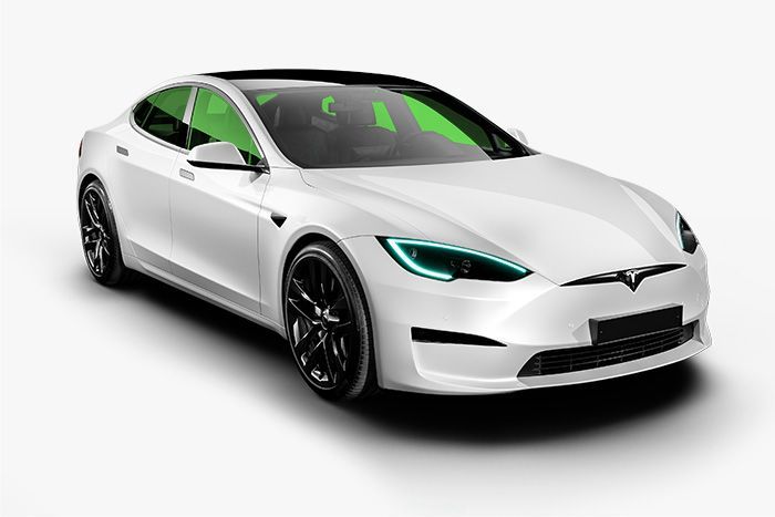 A white tesla model s with green lights on a white background.