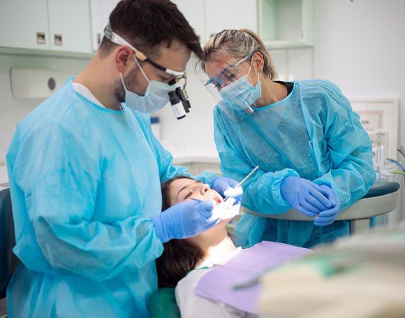 Dentists Wearing Mask — Haverhill, MA — Haverhill Dental Associates Inc Dentists Wearing Mask — Haverhill, MA — Haverhill Dental Associates Inc