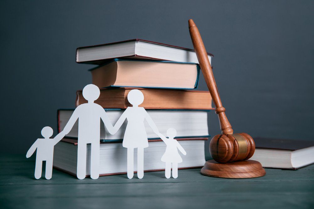 Paper of Family and Books with Judge Table — Divorce Lawyer in Gladstone, QLD