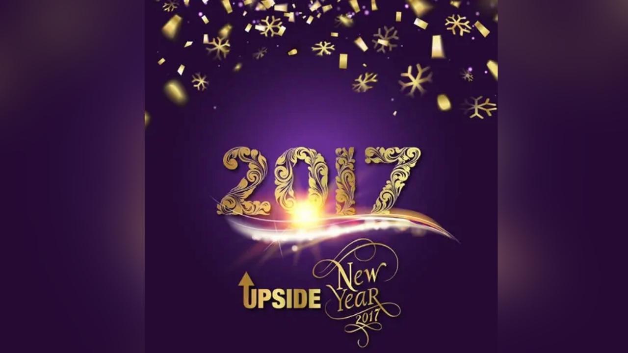 A new year 's greeting card with the year 2017 on a purple background