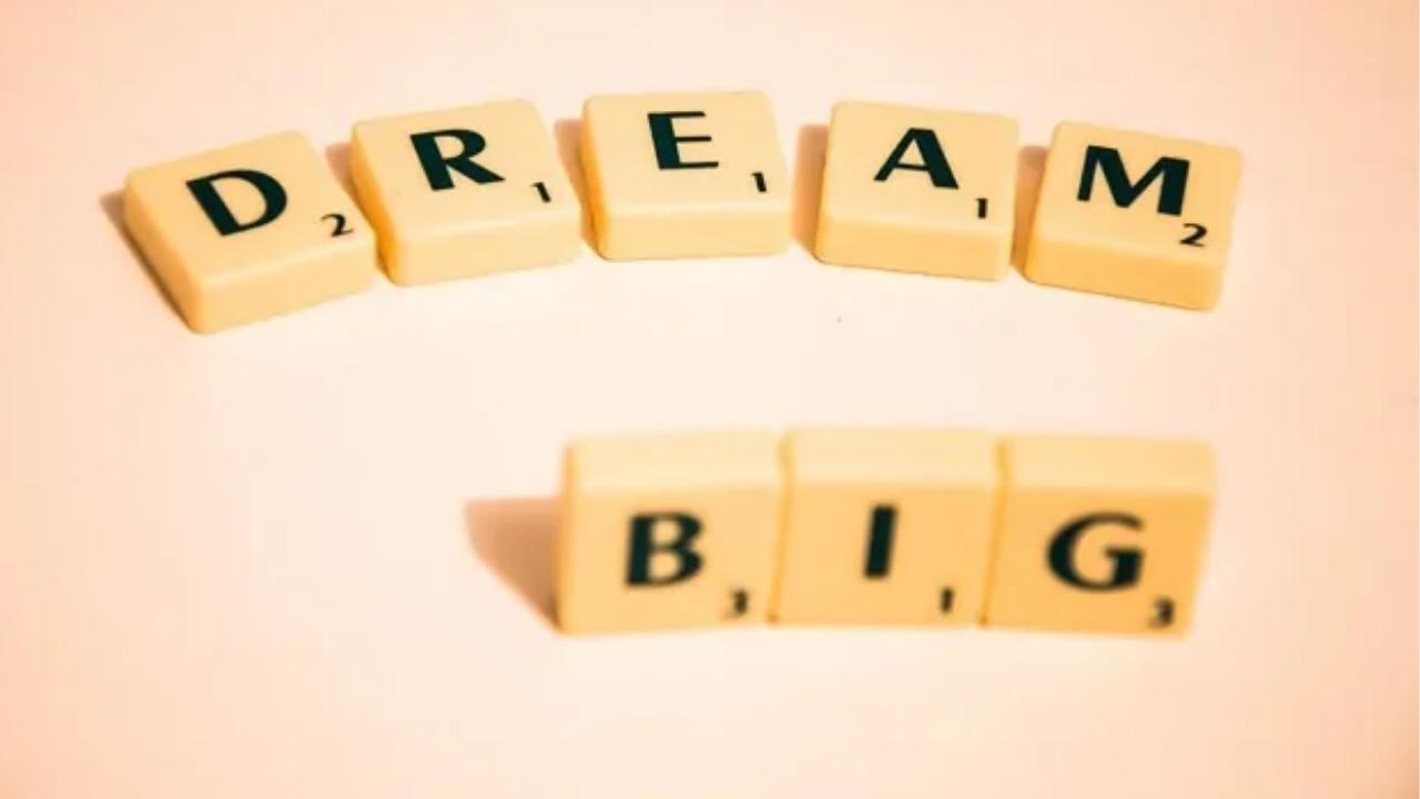 Scrabble tiles spell out the words dream big
