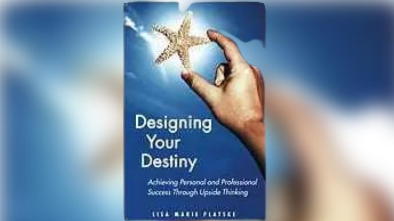 A person is holding a starfish on the cover of a book titled designing your destiny