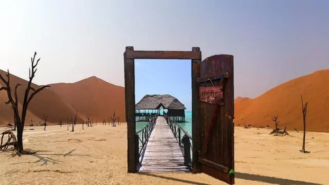 An open door in the desert leads to a beach house