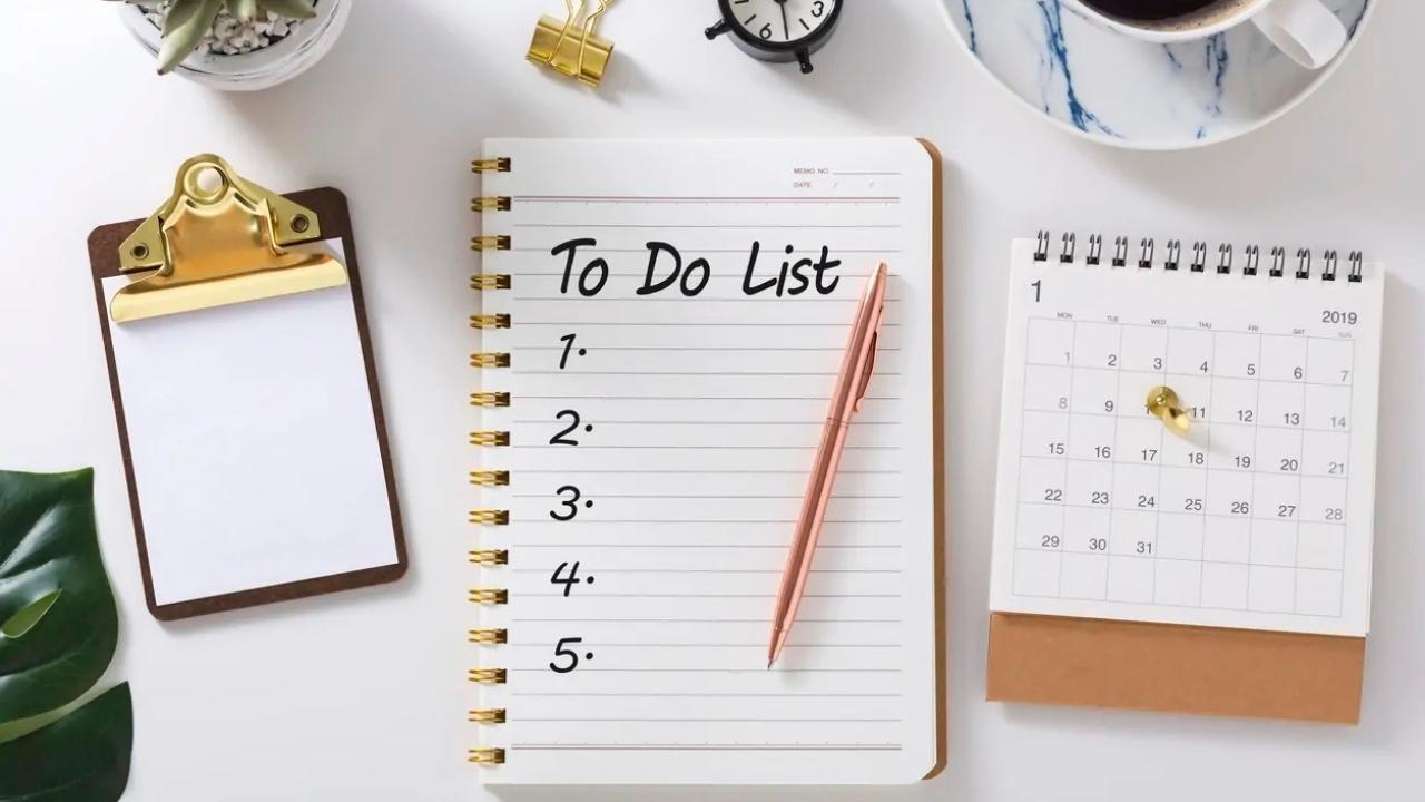 A to do list is written in a notebook with a pen.