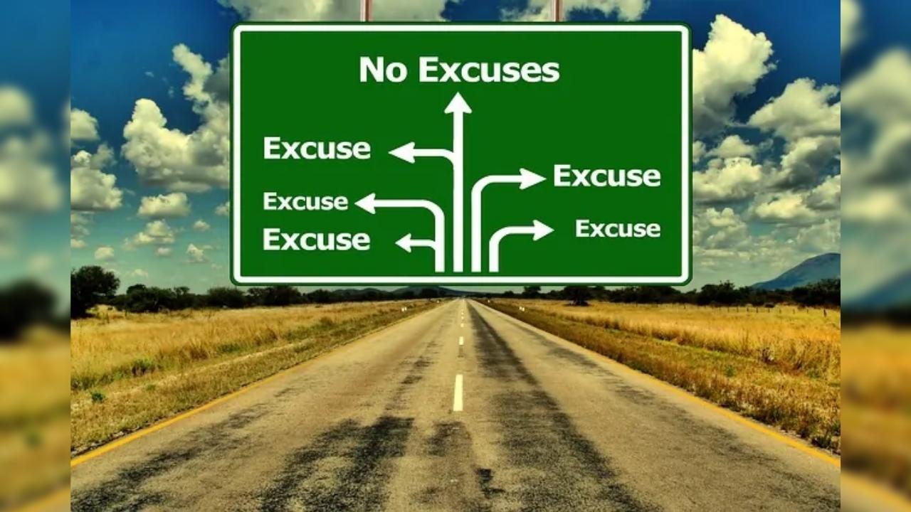 A green sign on the side of a road that says no excuses