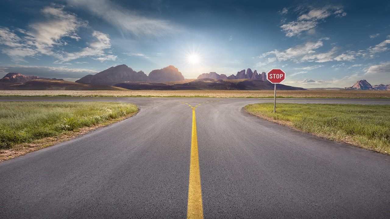There is a stop sign on the side of the road.