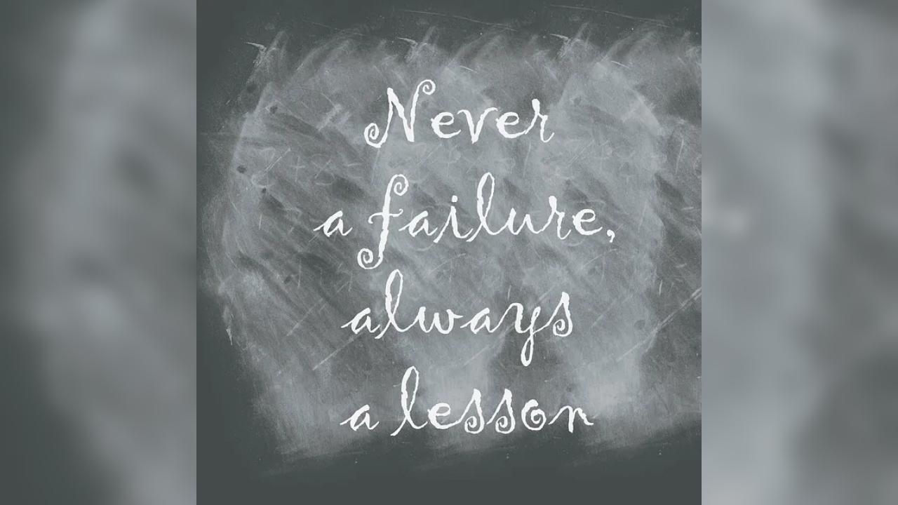 A chalkboard with the words never a failure always a lesson written on it