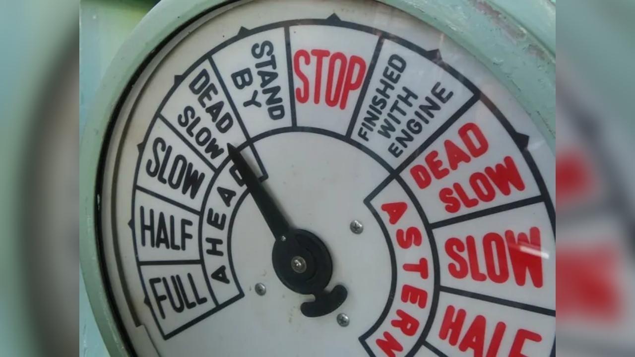 A close up of a gauge that says stop on it