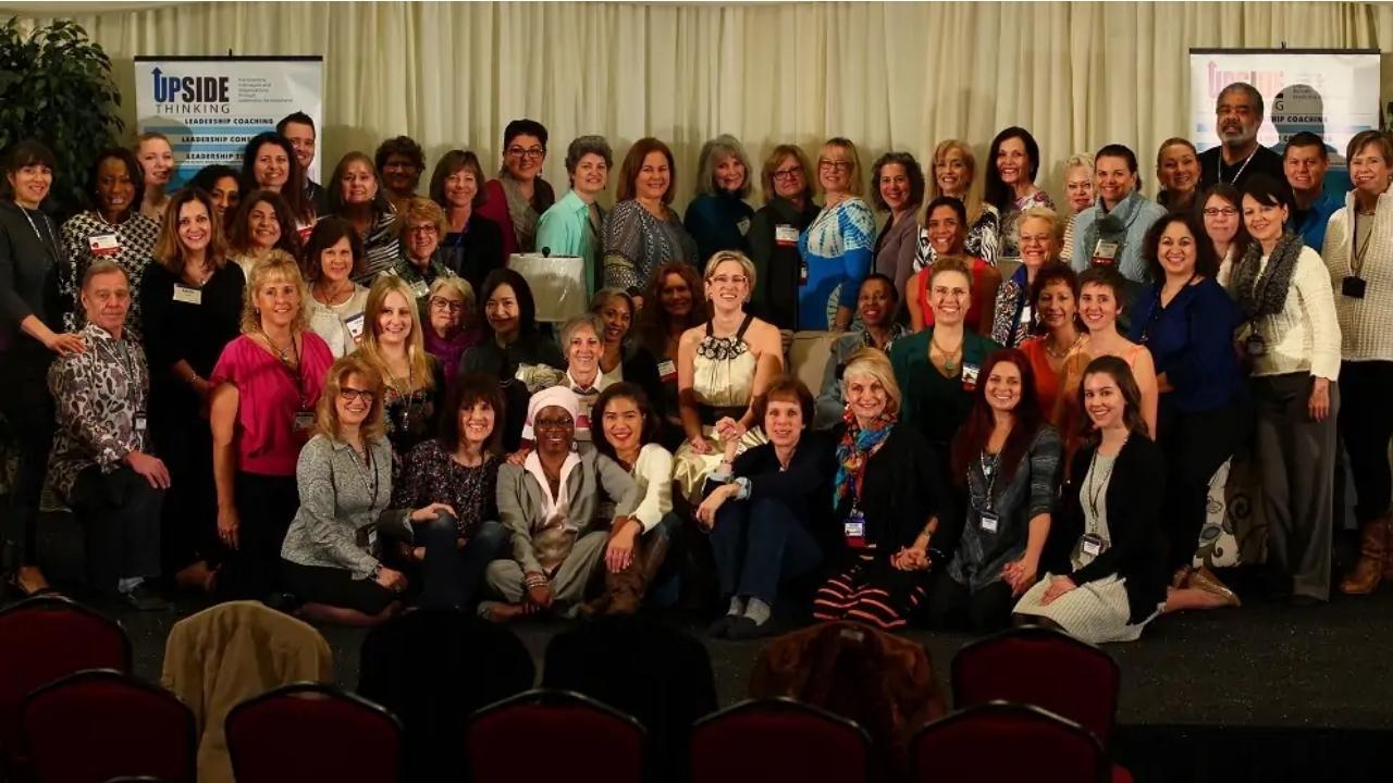 A large group of people are posing for a group photo