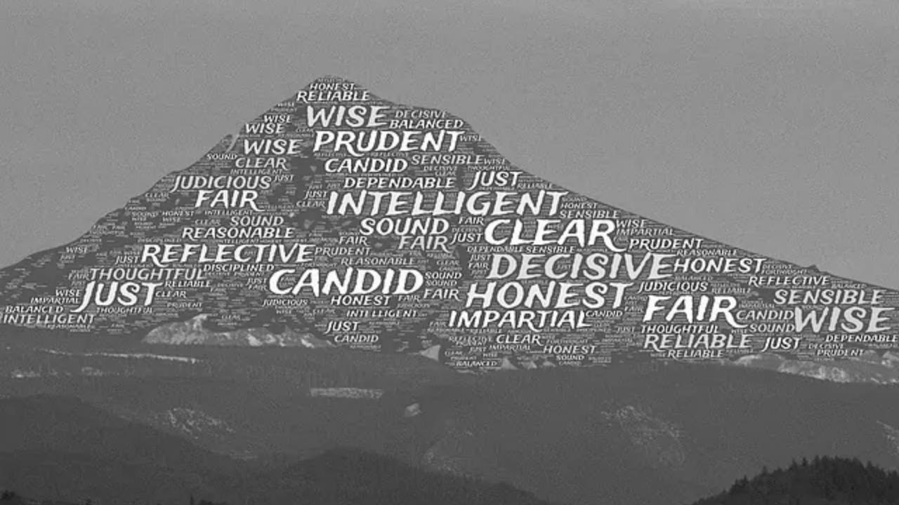 A black and white photo of a mountain covered in words.
