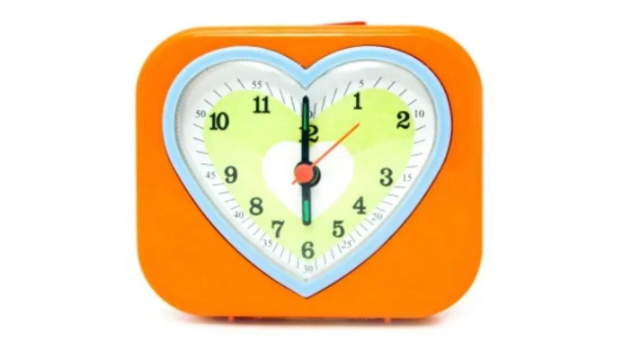 An orange heart shaped clock shows the time as 4:20