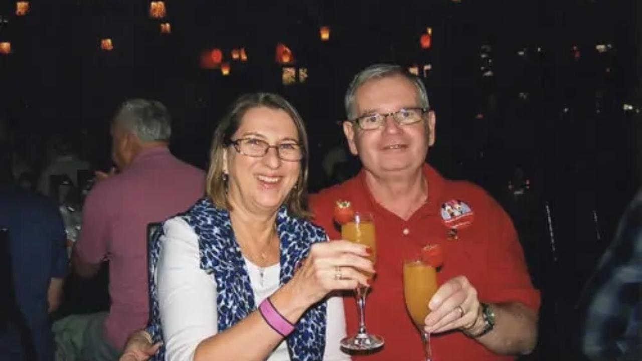A man and a woman are toasting with wine glasses