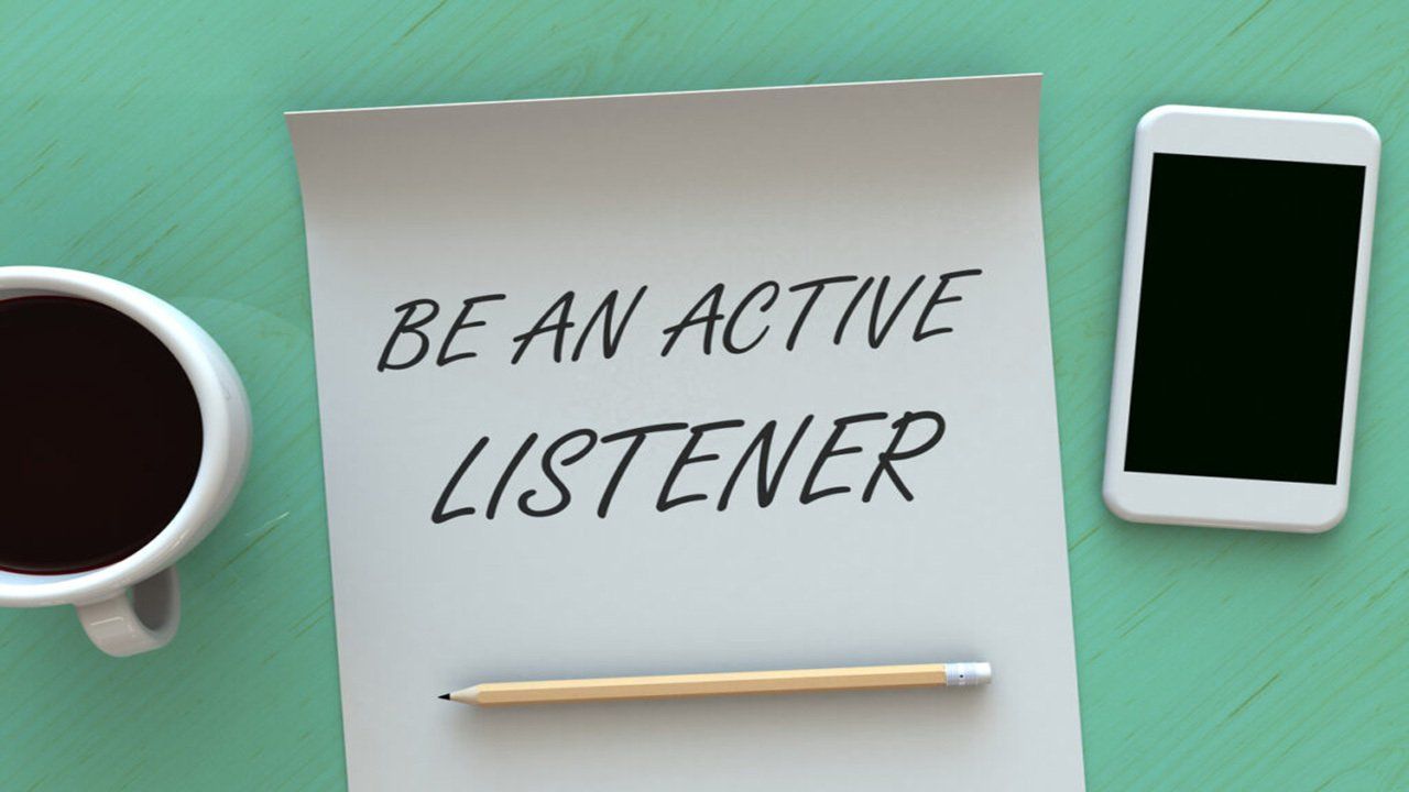 A piece of paper with the words be an active listener written on it