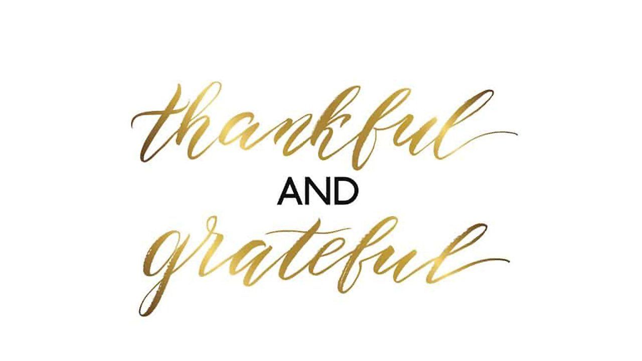 The words thankful and grateful are written in gold on a white background.