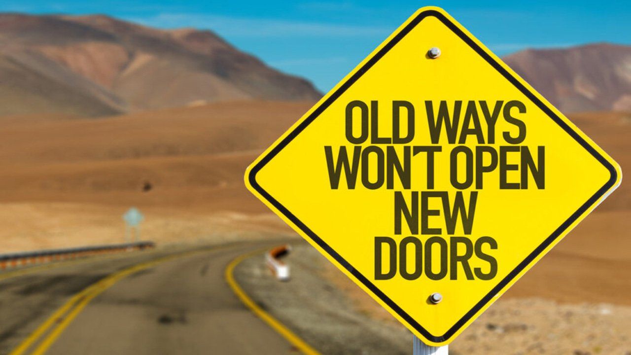A yellow sign that says old ways won t open new doors