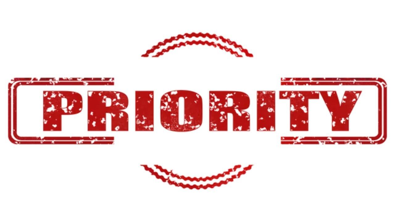 A red priority stamp on a white background