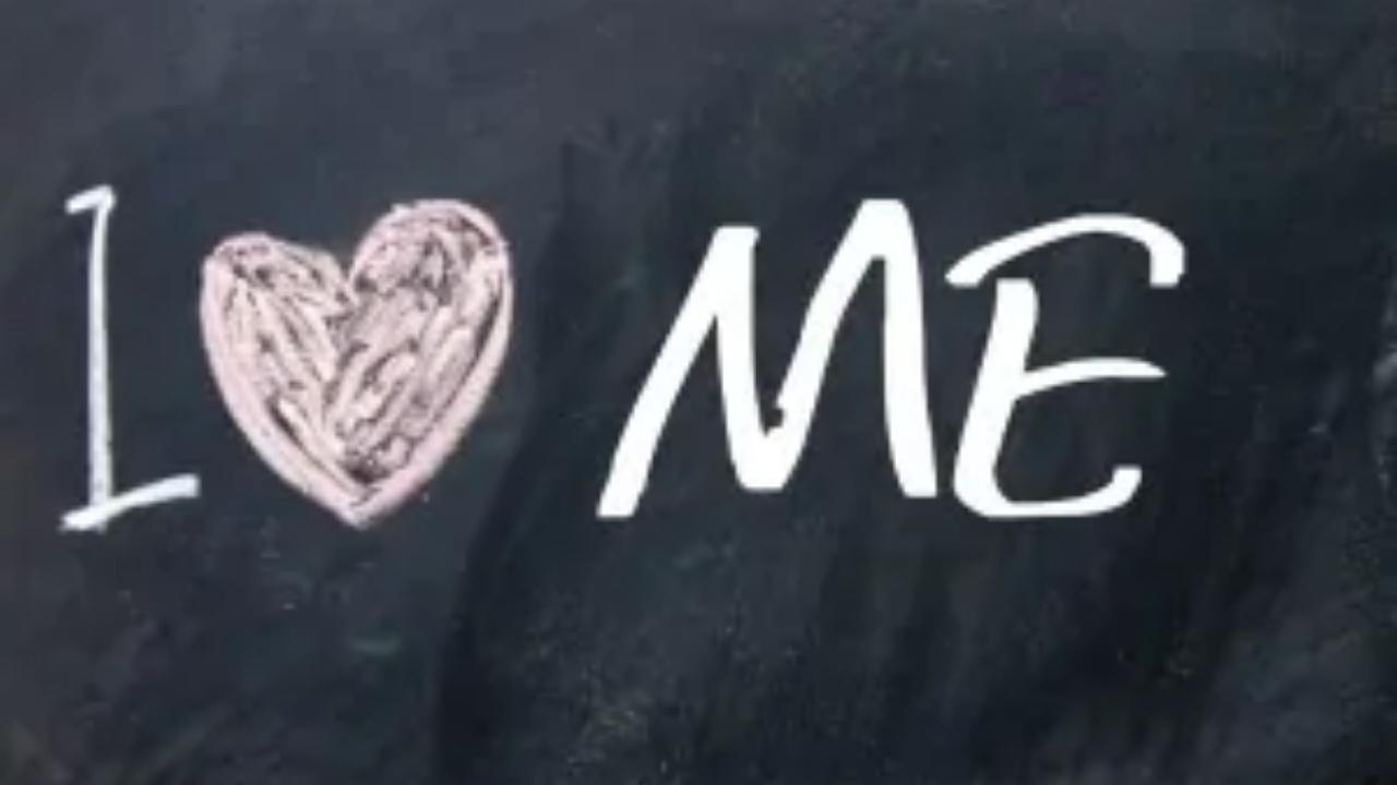 A blackboard with the words i love me written on it
