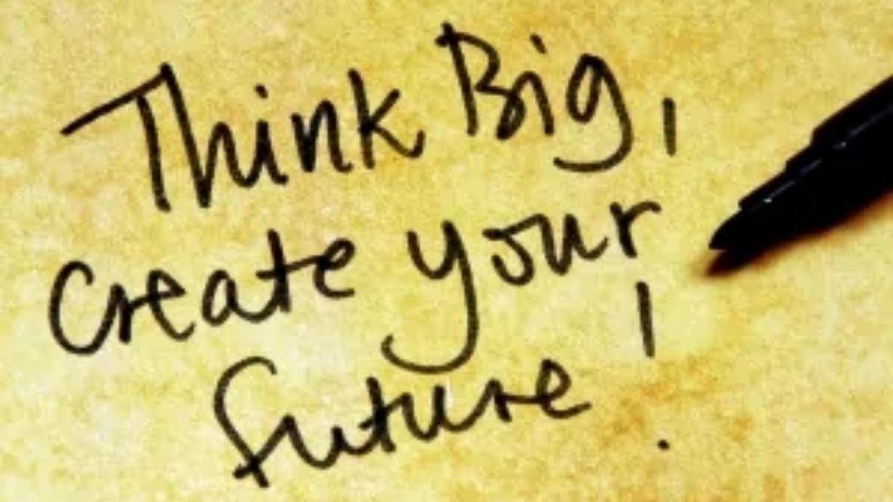 A piece of paper that says think big create your future