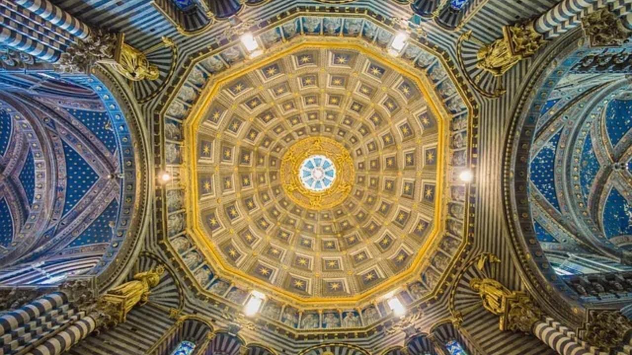 Looking up at the dome of a building.